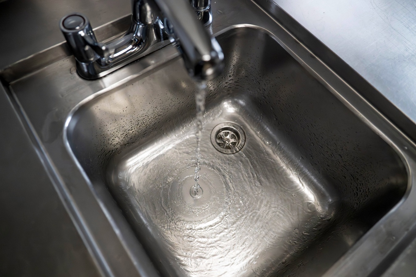 Water running into an empty sink