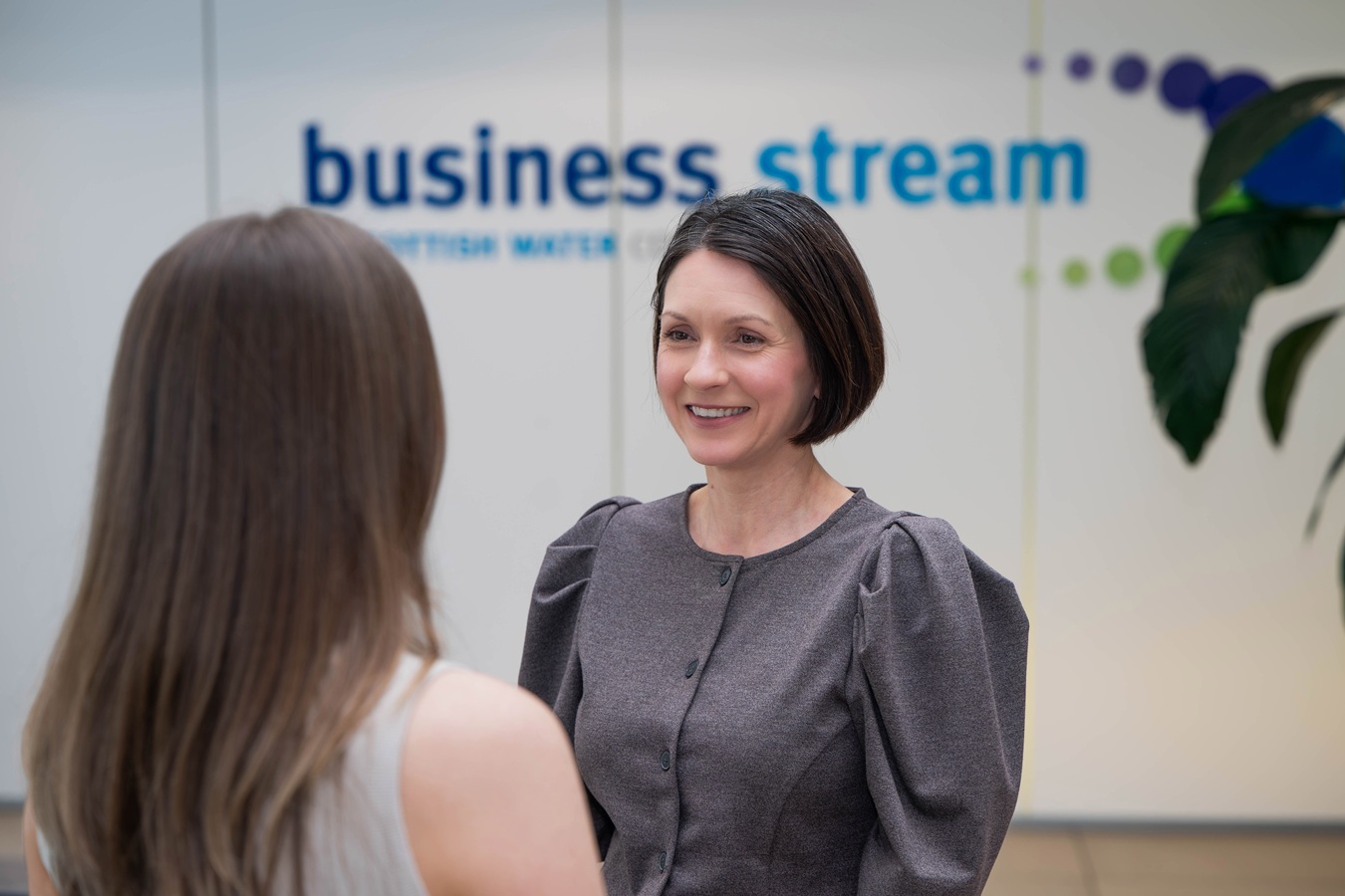 Two women talking at Business Stream HQ