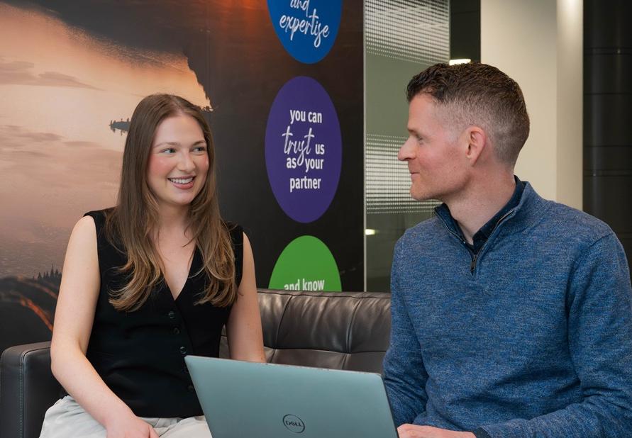 Man and woman collaborating on laptop