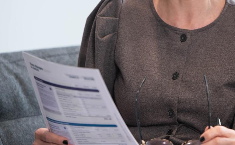 A woman examining her bill and easily understanding it