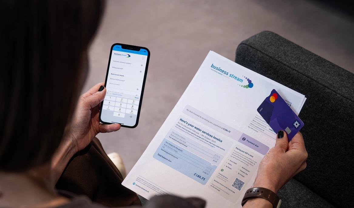Woman paying a bill on her phone